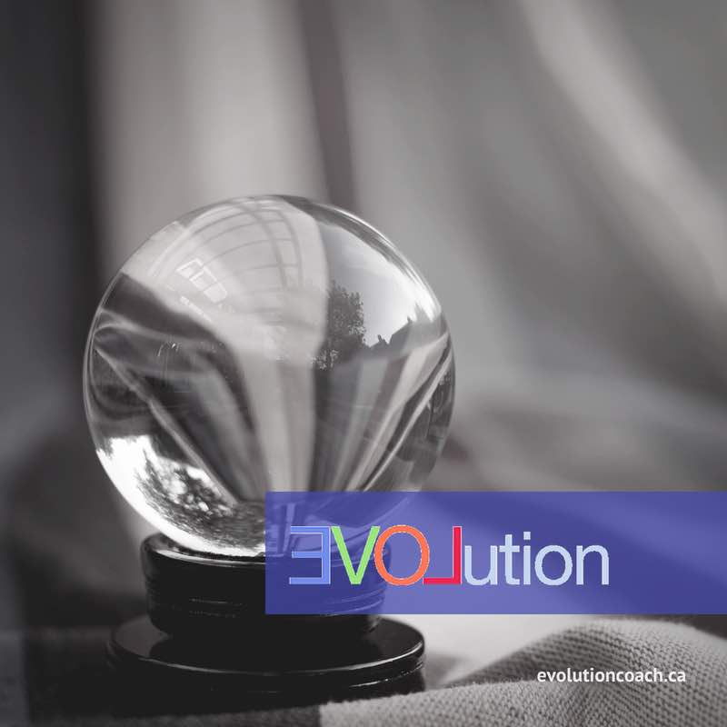 Picture of a crystal ball on a table. There is a purple banner with the word Evolution across it and the site address evolutioncoach.ca on the bottom.